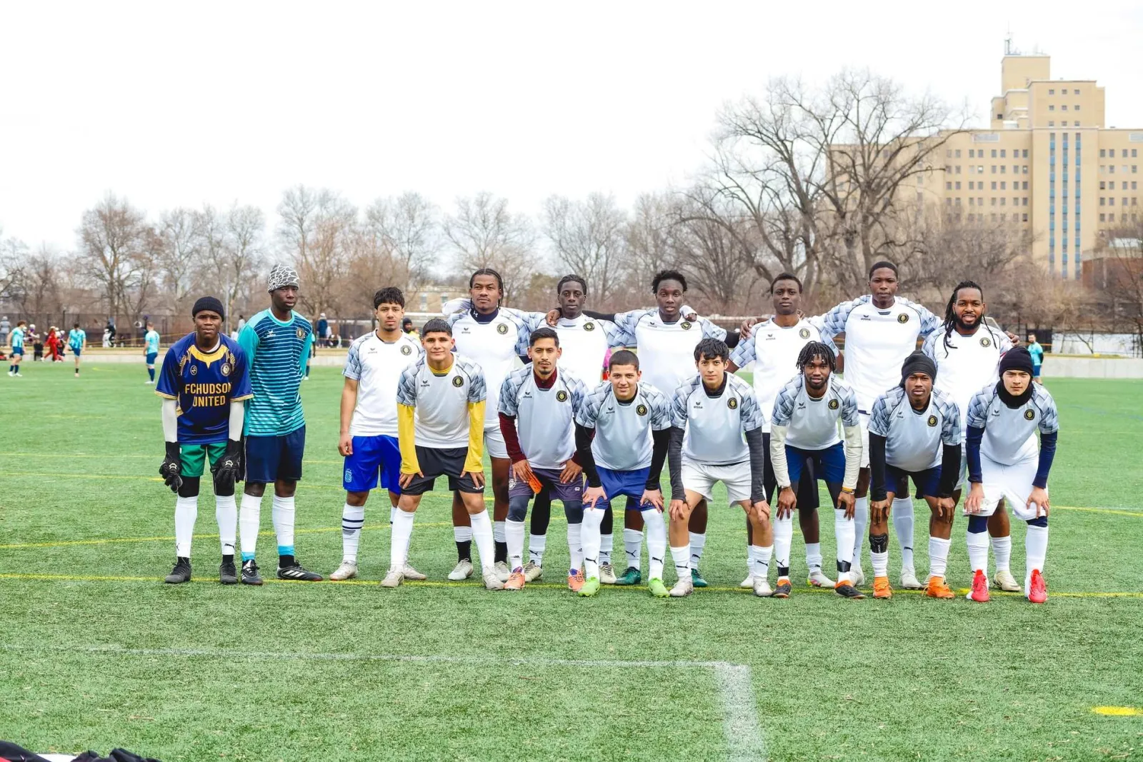 FC Hudson United players and staff on the pitch in New York City